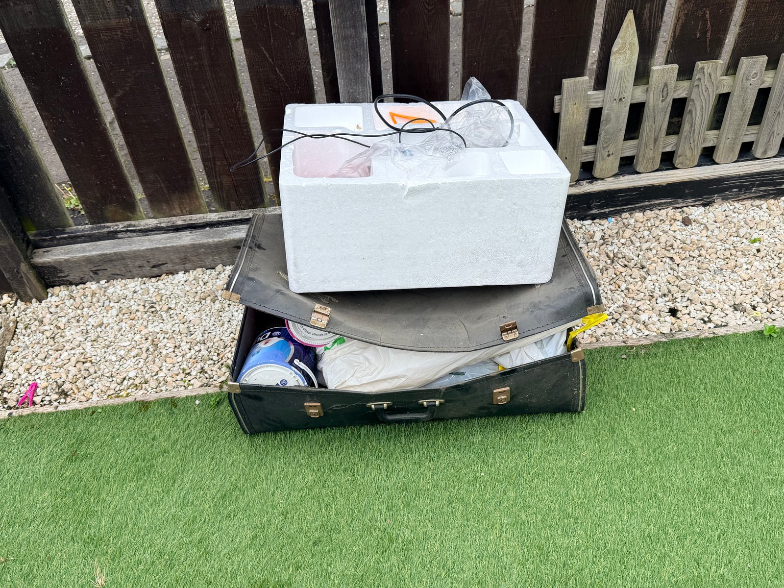Suitcases and old fireplace parts ready for the trailer